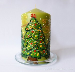 Christmas-candle-engraved-with-festooned-christmas-trees                                                  